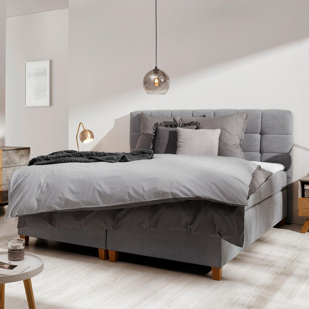 Boxspring posteľ sivej farby Jerry